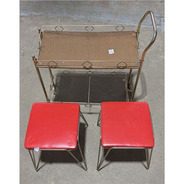 Vintage mid-century two-tier rolling bar cart with a gold-tone metal frame and wood-grain laminate s