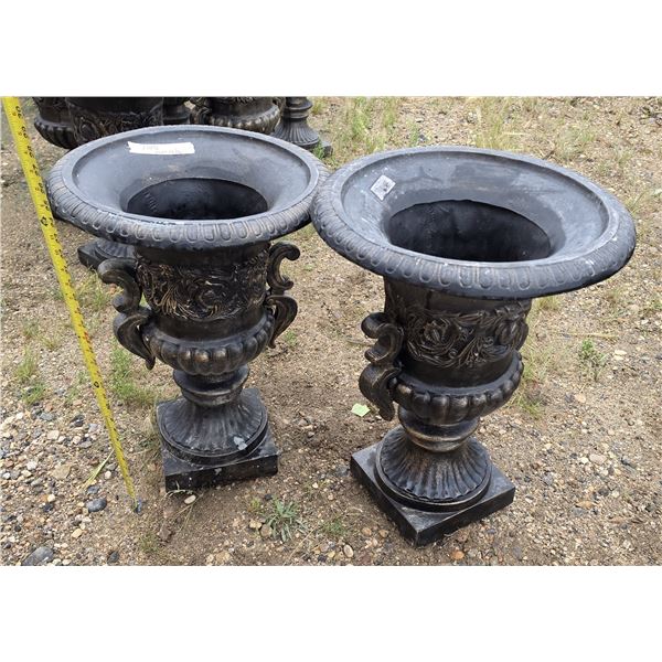 Pair of plastic classic black-finished decorative garden urn planters with ornate side handles.