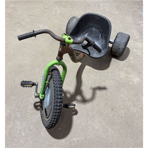 Madd Gear Drift Trike in black and green, featuring a bucket seat and a knobby front tire.