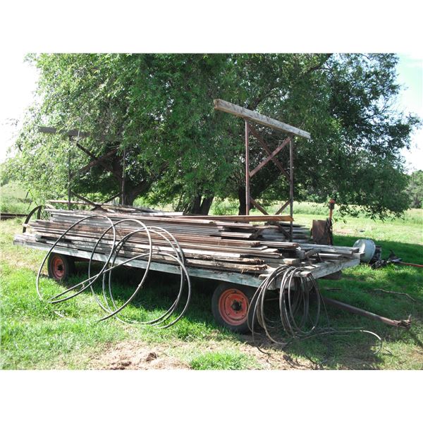 4 wheel hay rack w/ assorted lumber - tongue & grrove boards, etc.