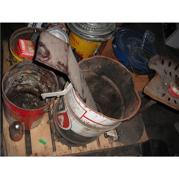 pallet of oil barrels (BA, Shell, Co-op), hub caps, engione parts, etc.