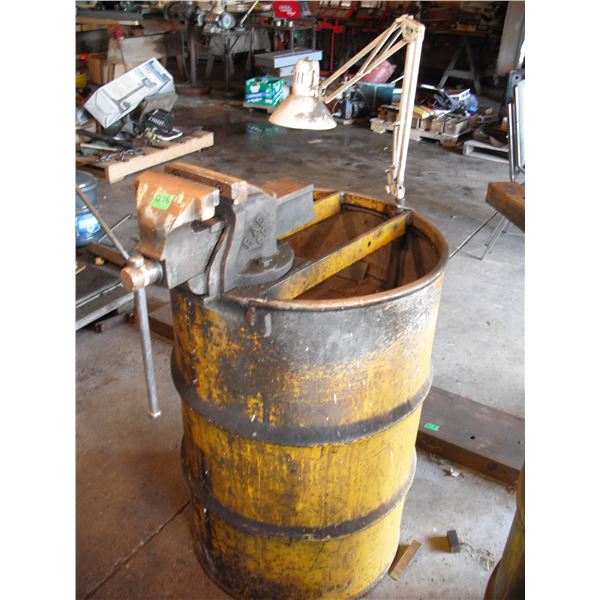 barrel made into workstand with bench vise (Canada) and work light