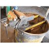Image 2 : barrel made into workstand with bench vise (Canada) and work light