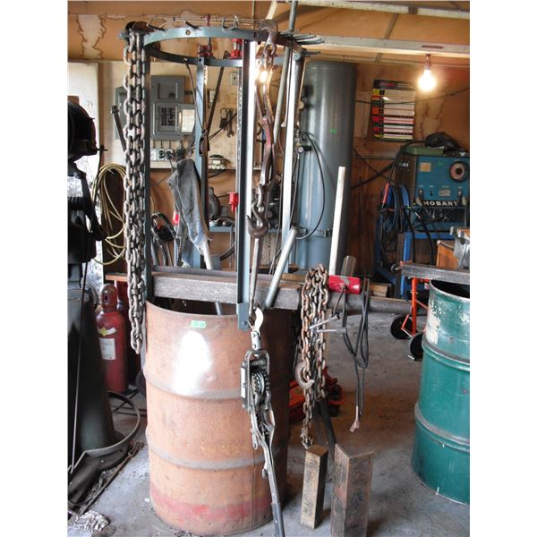 barrel made into work rac with cable winch, chains, etc.