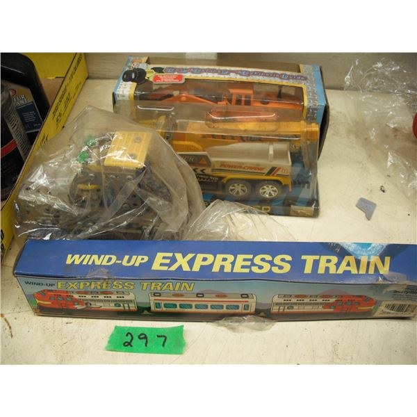 mecanno dozer, wind-up train, toy truck and digger in box