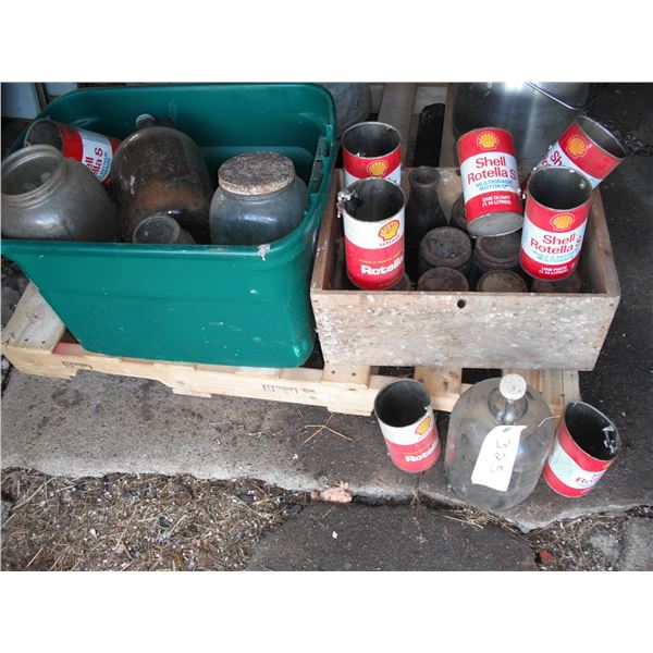 crate and tote with oil tins, bottles, etc.