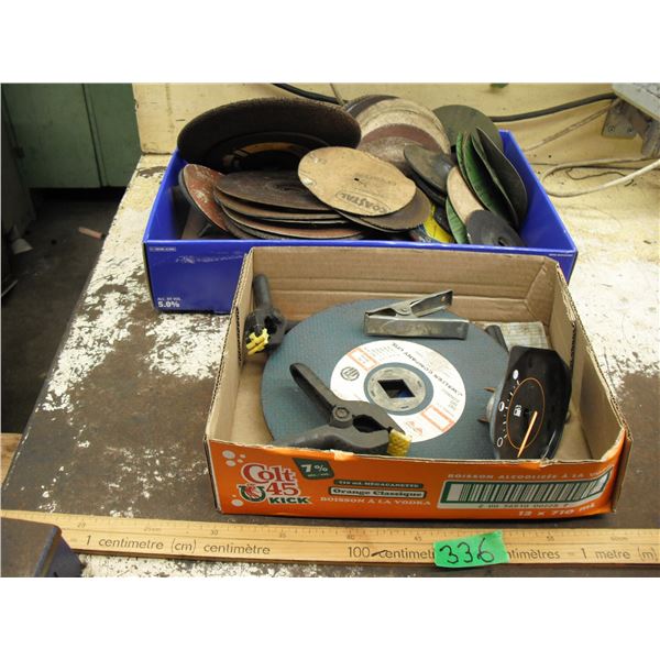 lot of sanding pads, grinding discs, clamps, etc.