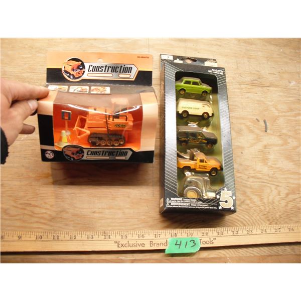 windup bulldozer and diecast cars and tractor