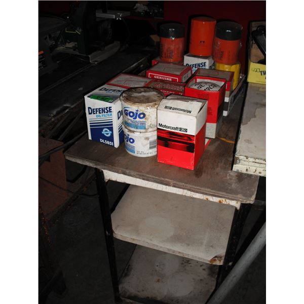 large lot of oil with work shelf/table