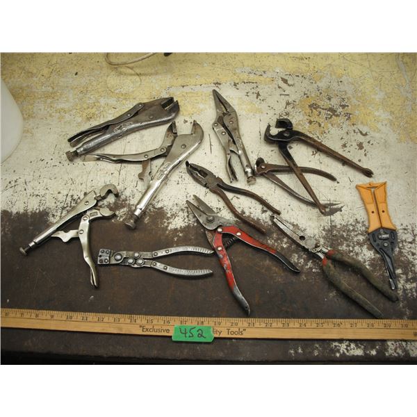 lot of vice grips, snips, pliers, etc.