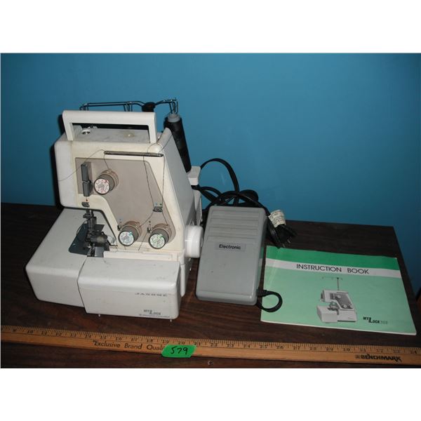 Janome sewing machine w/ pedal and booklet