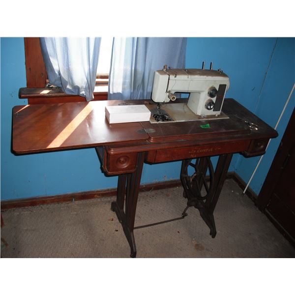 Kenmore sewing machine with cast iron base and accessories