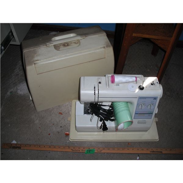 Kenmore sewing machine with pedal, manual and accessories