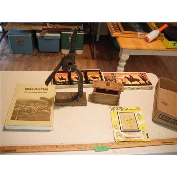 Waldheim history book, bottle capper, butter press, draw toy, and Tumbling tumbleweeds 8 tracks