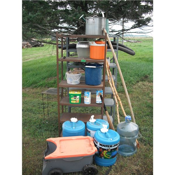 2 shelves, water jugs, garden tools, electric fencer, etc.