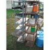 Image 5 : 2 shelves, water jugs, garden tools, electric fencer, etc.