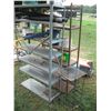 Image 6 : 2 shelves, water jugs, garden tools, electric fencer, etc.