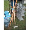 Image 7 : 2 shelves, water jugs, garden tools, electric fencer, etc.