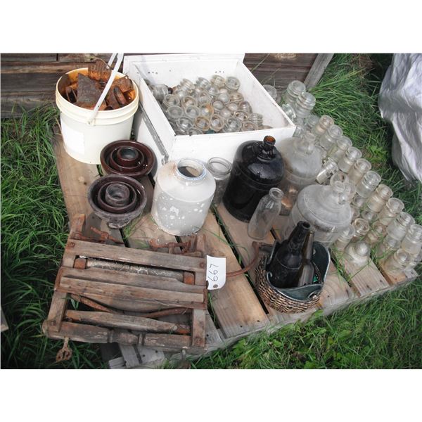lot of glass jugs, insulators, clothes ringer, etc.