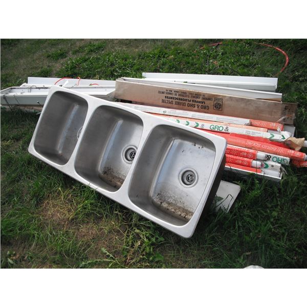 lot of halogen bulbs, light fixtures and 3 bay stainless steel sink