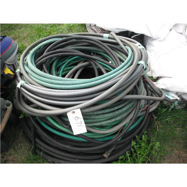 large lot of garden hoses