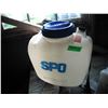 Image 3 : partial jug of roundup and backpack sprayer