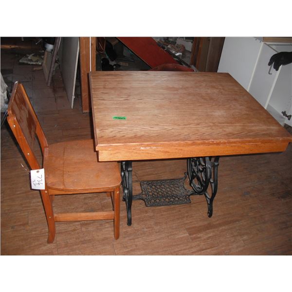 table with sewing machine cast base and chair