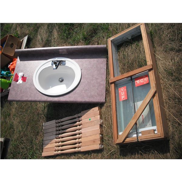 sink with counter, stair rails, sliding window