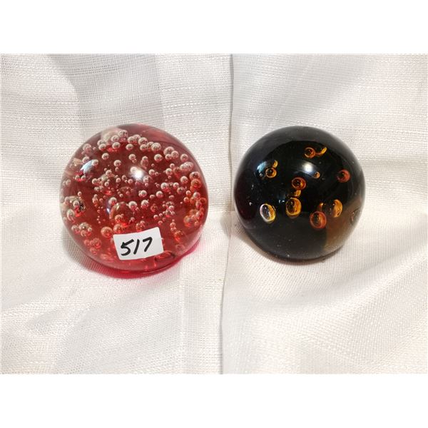Two glass paper weights