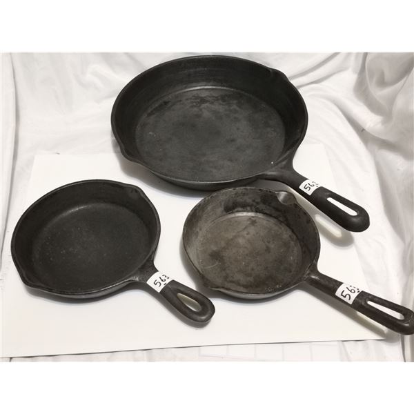 Set of three cast iron frying pans