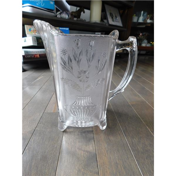 EAPG 1880’S LARGE PITCHER, FLORAL DESIGN, 8 ½ “TALL SMALL CHIP ON ONE FOOT