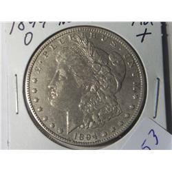 1894-O AU + MORGAN DOLLAR