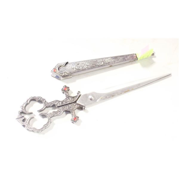 ORNATE PAIR OF LONG SCISSORS IN METAL SHEATH
