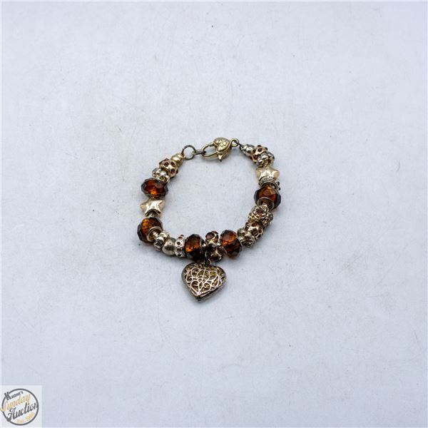 ORANGE JEWELED CHARM BRACELET WITH CLOVER MARK
