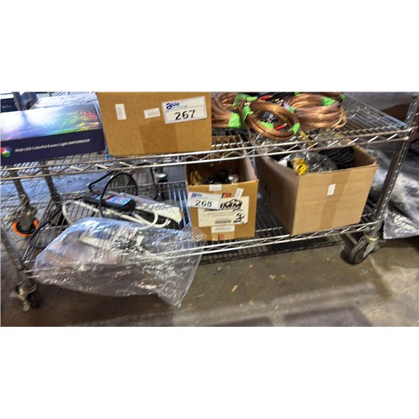 SHELF OF ASSORTED ITEMS INCLUDING POWER OUTLETS , SIDE BAGS AND MORE