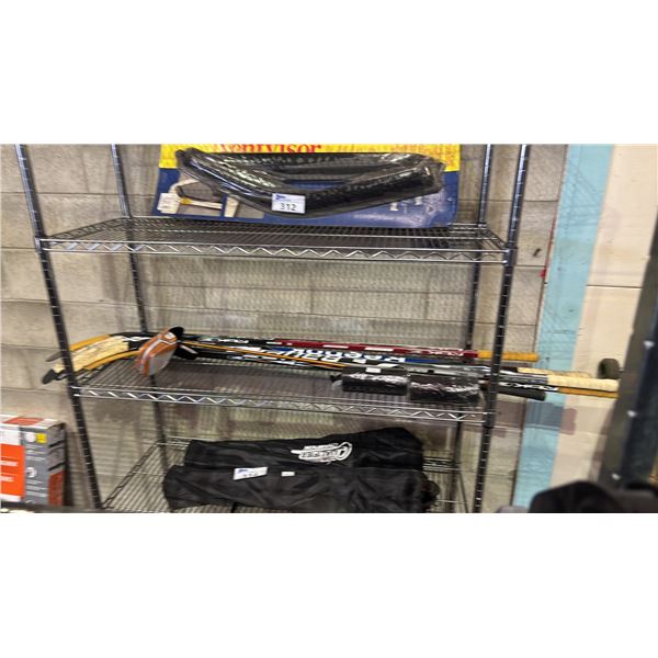SHELF OF HOCKEY STICKS, ERLIMAR FURY GOLF CLUB & 2 PACKS OF HOCKEY TAPE