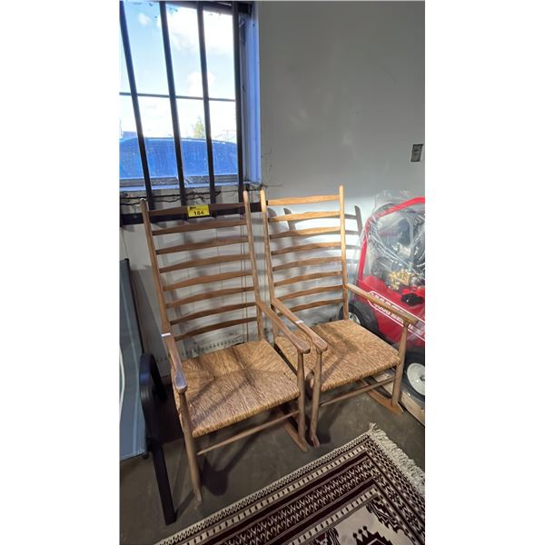 (2) VINTAGE WOOD LADDER BACK ROCKING CHAIRS WITH WOVEN RUSH SEATS
