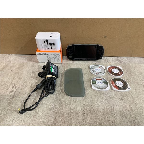 PSP With Travel Adapter, 4 Games & A Charger