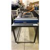 Image 2 : GREY METAL TABLE, ULINE SMALL PACKAGING ROLLER UNIT & 2 PAPER CUTTERS