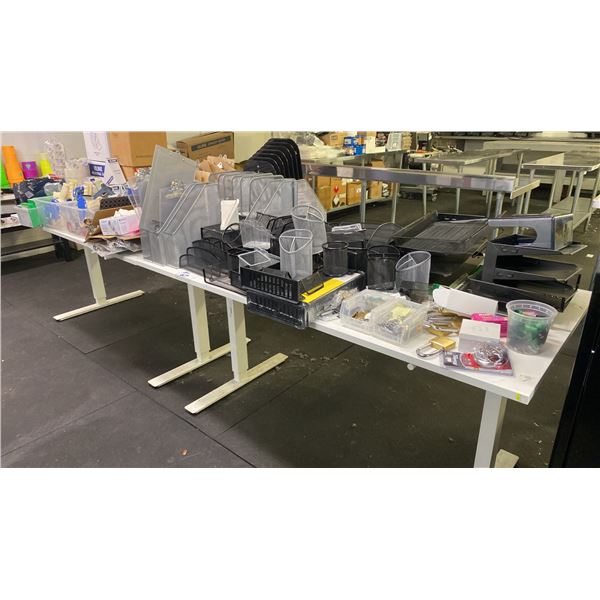 2 WHITE ADJUSTABLE HEIGHT TABLES WITH ASSORTED OFFICE/SHIPPING SUPPLIES INCLUDING TAPE DISPENSERS,