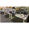 Image 1 : 2 WHITE ADJUSTABLE HEIGHT TABLES WITH ASSORTED OFFICE/SHIPPING SUPPLIES INCLUDING TAPE DISPENSERS,