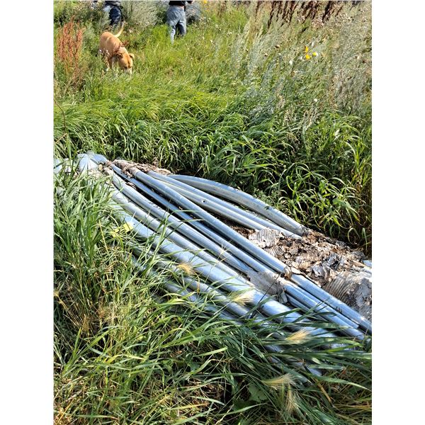 Frame Pipes Tarped Building