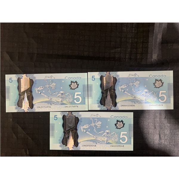 Three Canadian $5 Polymer Banknotes