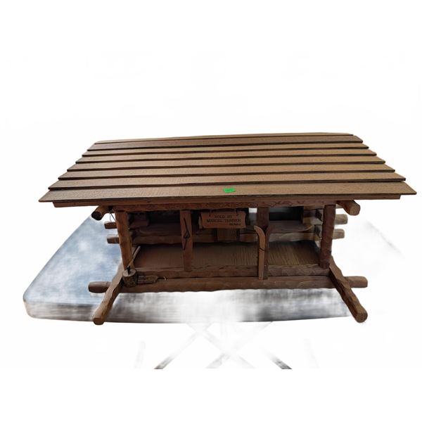 Wooden Log Cabin Model with 'Sold by Marcel Tessier RE/MAX' Sign