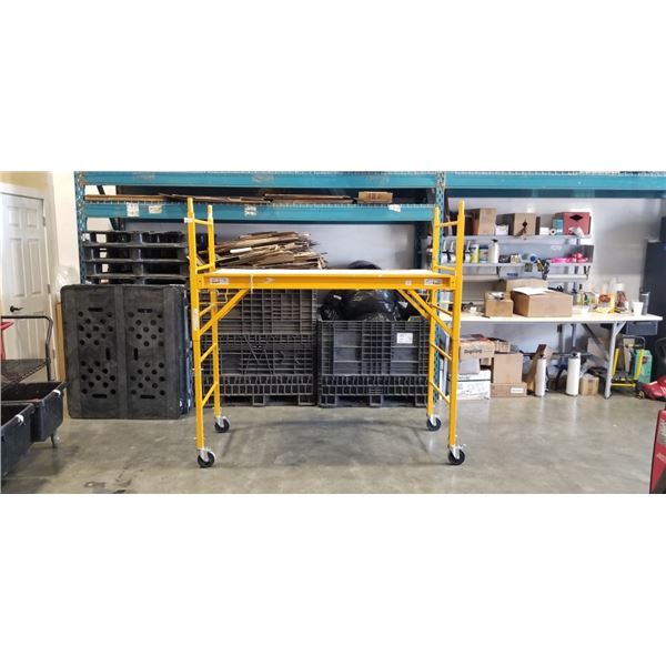 SECTION OF YELLOW ROLLING SCAFFOLDING 74 INCH X 30 INCH AND 74 INCH TALL, ONE PLATFORM