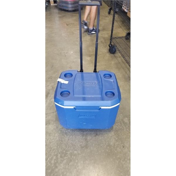 COLEMAN COOLER WITH WHEELS AND HANDLE.
