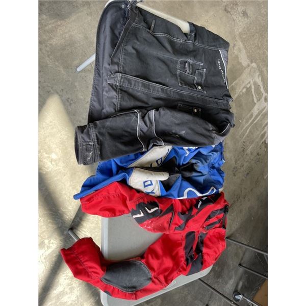 2 PAIRS OF FOX DIRT BIKE RIDING PANTS SIZE SMALL, AND HELLY HANSEN WORK JACKET SIZE XL