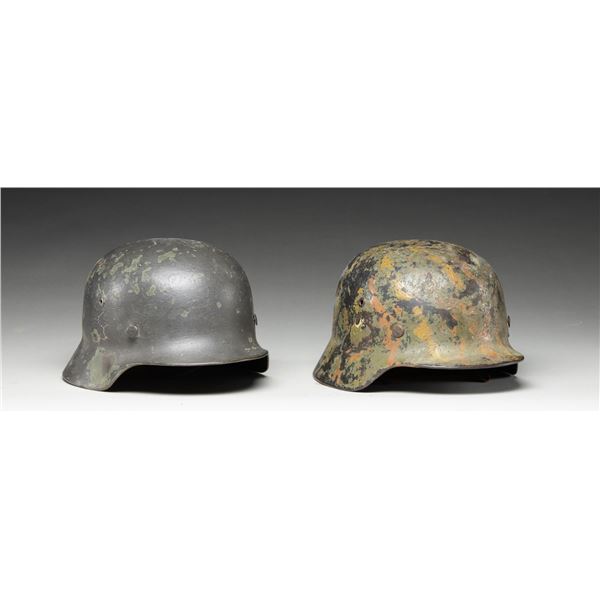 2 WWII GERMAN HELMETS.