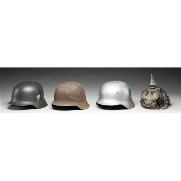 4 WWI & WWII GERMAN HELMETS.