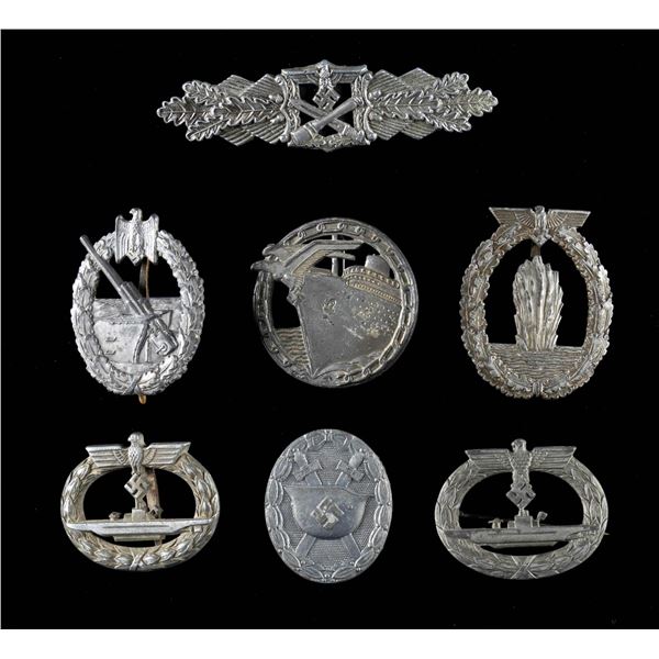 7 WWII STYLE GERMAN BADGES.
